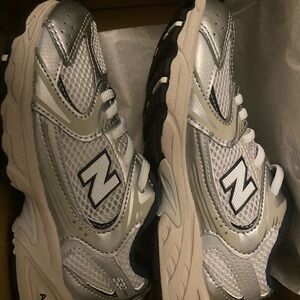 New Balance Gray and White Logo Design